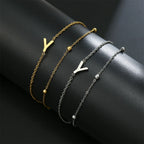 Pulsera de doble inicial oro y plata  y
