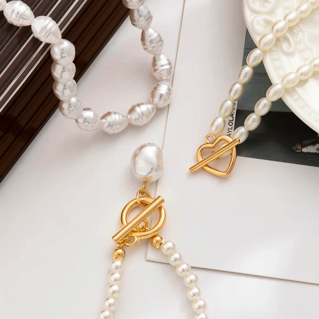 Set aus 3 Halsketten mit weißen Perlen 