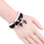 Perlenarmband mit Kreuz 